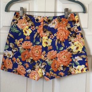 Floral shorts with large gold grommets